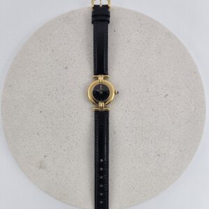 CARTIER - złoty zegarek vintage z ciemną tarczą widok z przodu