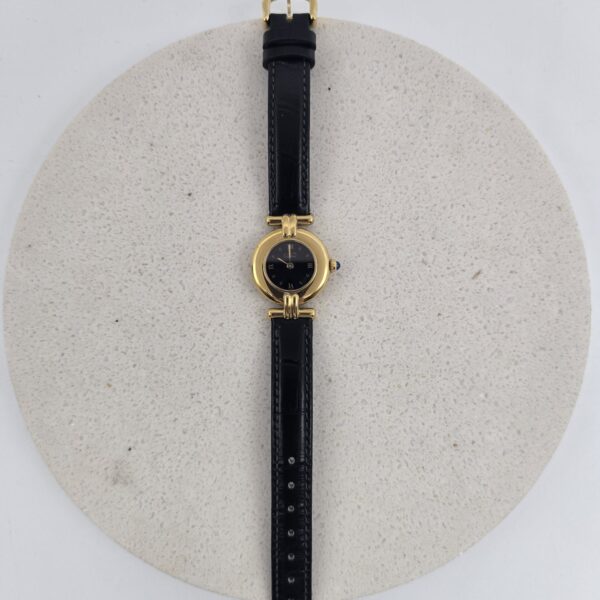 CARTIER - złoty zegarek vintage z ciemną tarczą widok z przodu
