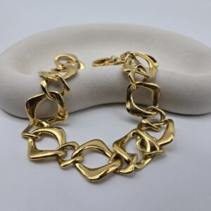 YSL - złoty naszyjnik na ekspozytorze