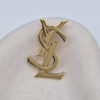 YSL - złota broszka vintage z monogramem