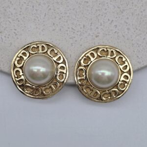 CHRISTIAN DIOR - złote klipsy z perłą i monogramem CD