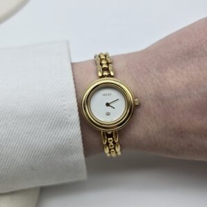 GUCCI - złoty zegarek vintage z wymiennymi bezelami na ręce