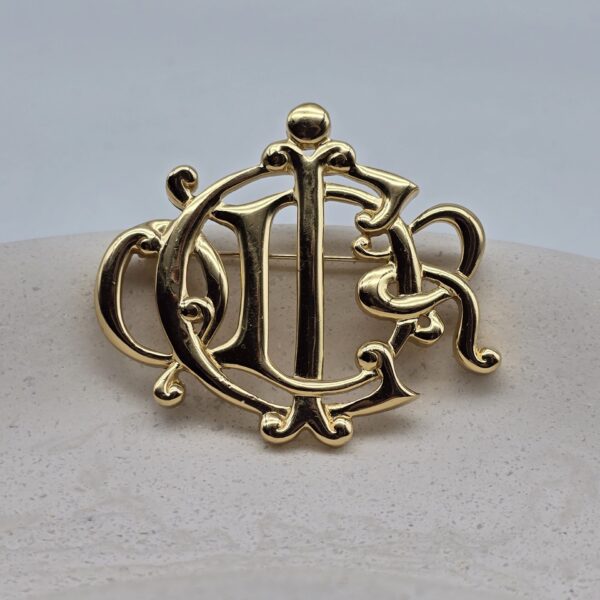 CHRISTIAN DIOR - złota broszka vintage z monogramem