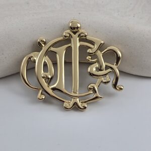 CHRISTIAN DIOR - złota broszka vintage z monogramem