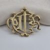 CHRISTIAN DIOR - złota broszka vintage z monogramem