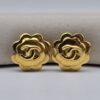 CHANEL - złote klipsy vintage w kształcie kamelii