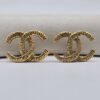 CHANEL - złote klipsy vintage CC fakturowane