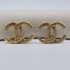 CHANEL - złote klipsy vintage CC fakturowane