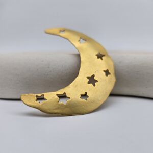 KENZO - złota broszka vintage leżac