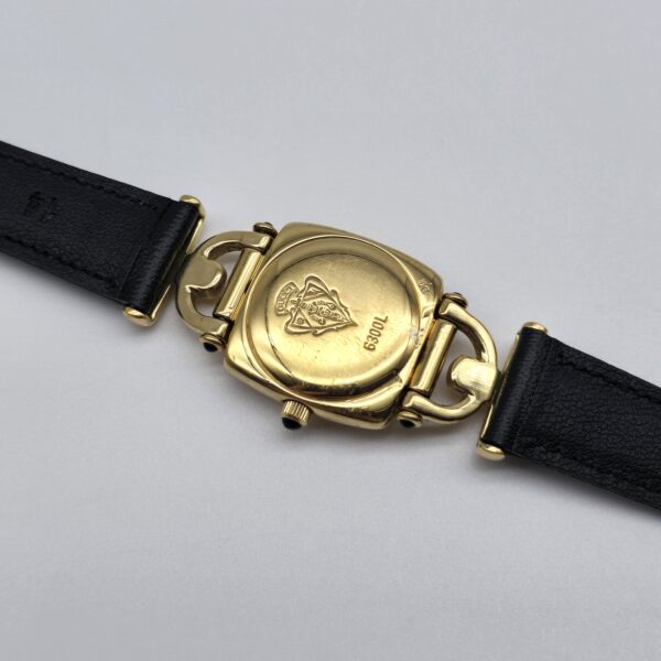 GUCCI - pozłacany zegarek vintage na czarnym pasku bokiem