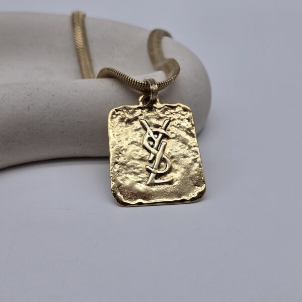 YSL - pozłacany naszyjnik vintage z blaszką obok nerki