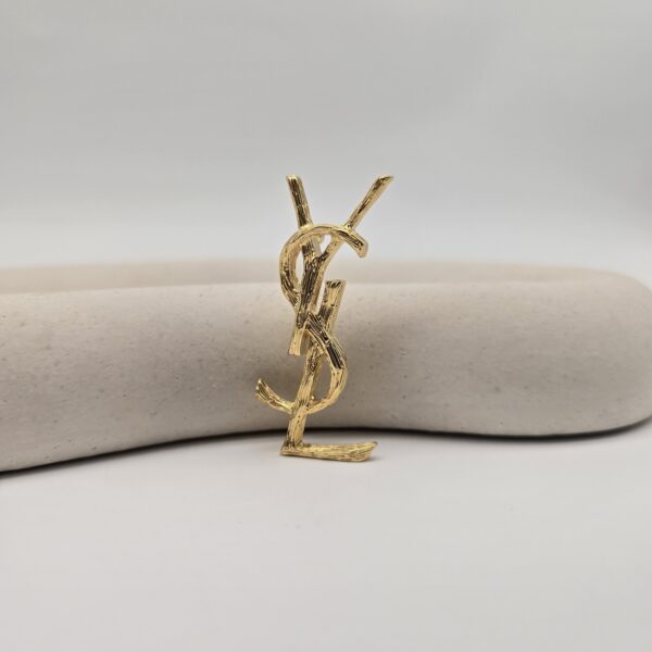 YSL - delikatne złota broszka vintage w kształcie monogramu dodatkowe drugie