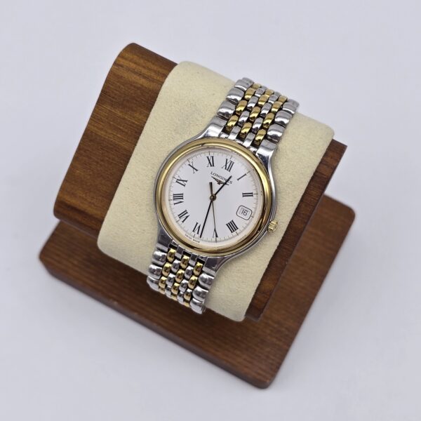 LONGINES - klasyczny zegarek vintage z rzymskimi indeksami na stojaku
