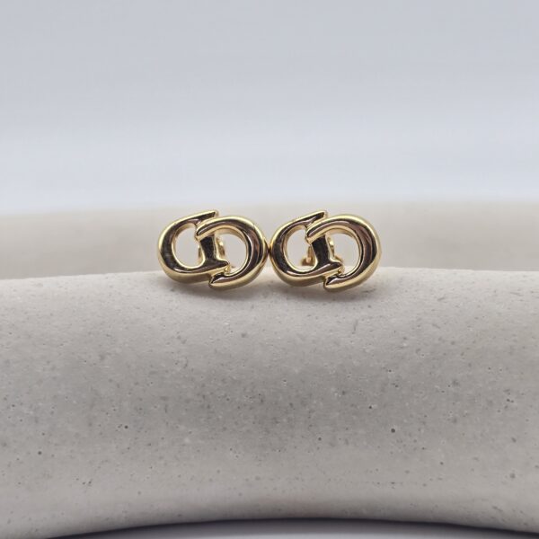 DIOR - malutkie i minimalistyczne klipsy vintage na podkładce