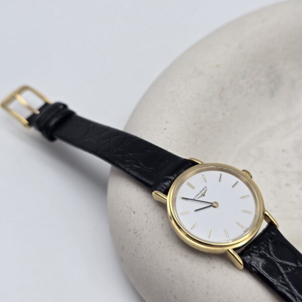 Longines zegarek vintage na czarnym pasku koperta