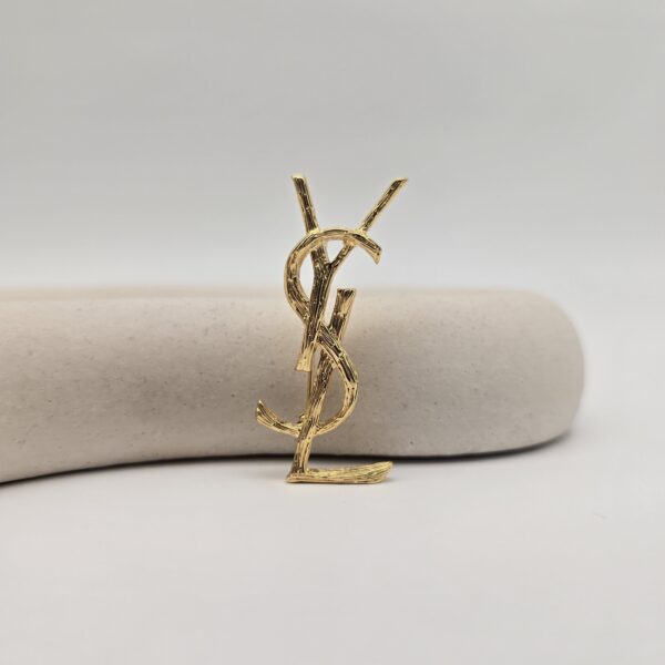 YSL - delikatne złota broszka vintage w kształcie monogramu