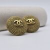 CHANEL - złote klipsy vintage z motywem CC