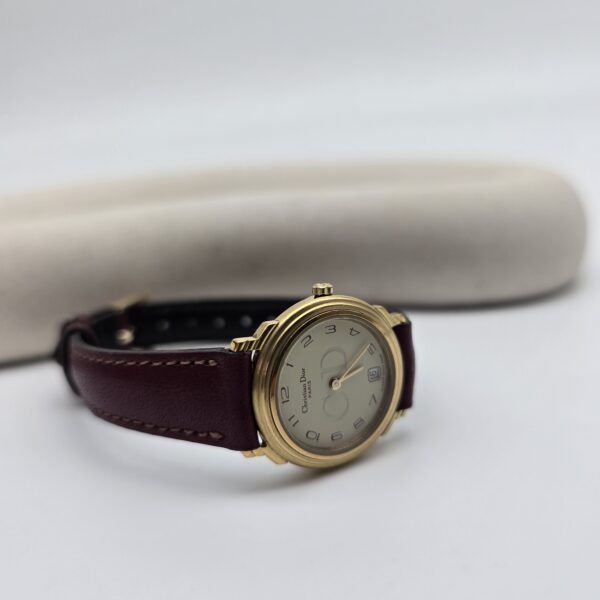 DIOR - minimalistyczny zegarek vintage z monogramem przy podkładce