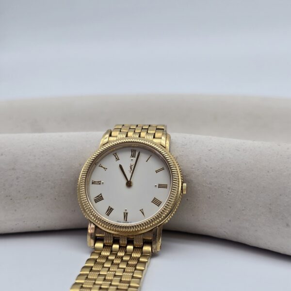 YSL – złoty zegarek vintage na bransolecie z rzymskimi indeksami, lata 90. przód