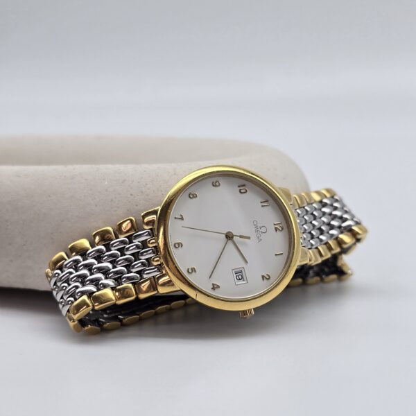 "OMEGA – zegarek vintage na bransolecie w bikolorze, lata 80."