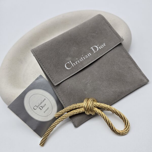 DIOR - złota broszka vintage, asymetryczny węzeł, lata 80.