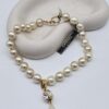 CHANEL - perłowy naszyjnik vintage z wiszącym kryształkiem i łezką, lata 80.