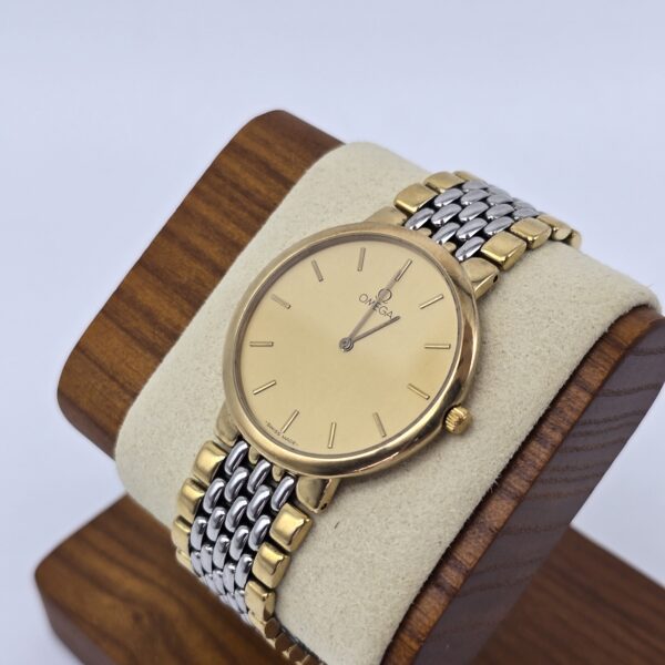 OMEGA De Ville - elegancki zegarek vintage na bransolecie z złotą tarczą stojak