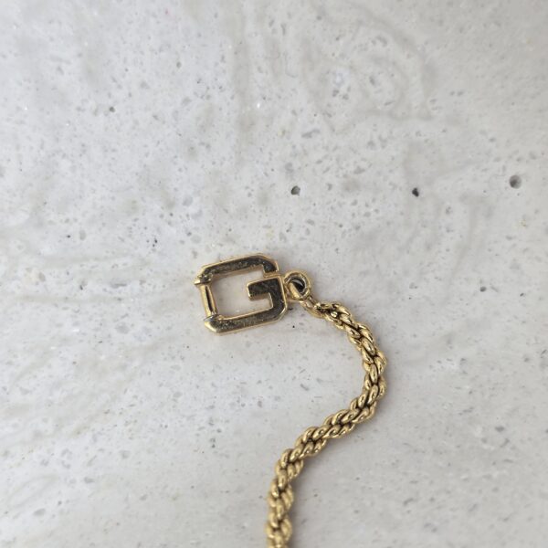GIVENCHY - elegancka bransoletka vintage z motywem plecionym logo