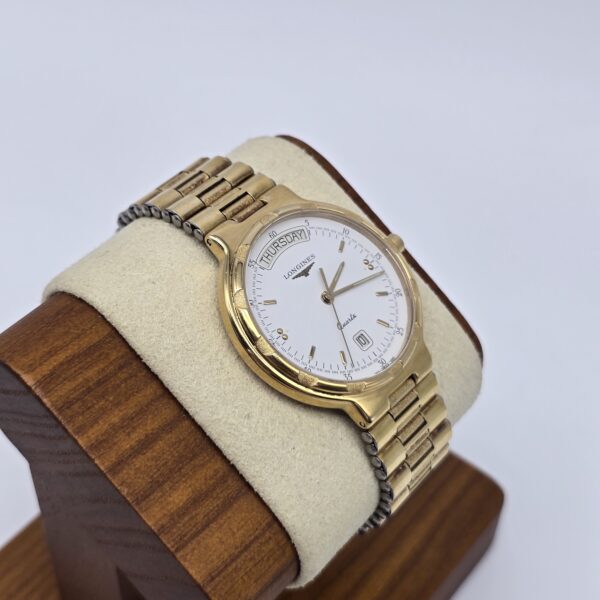 LONGINES Conquest - zegarek vintage na bransolecie z datownikiem stojak